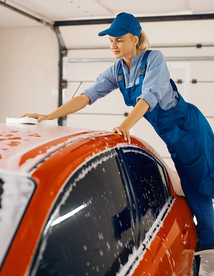 female-washer-wipes-the-automobile-windshield